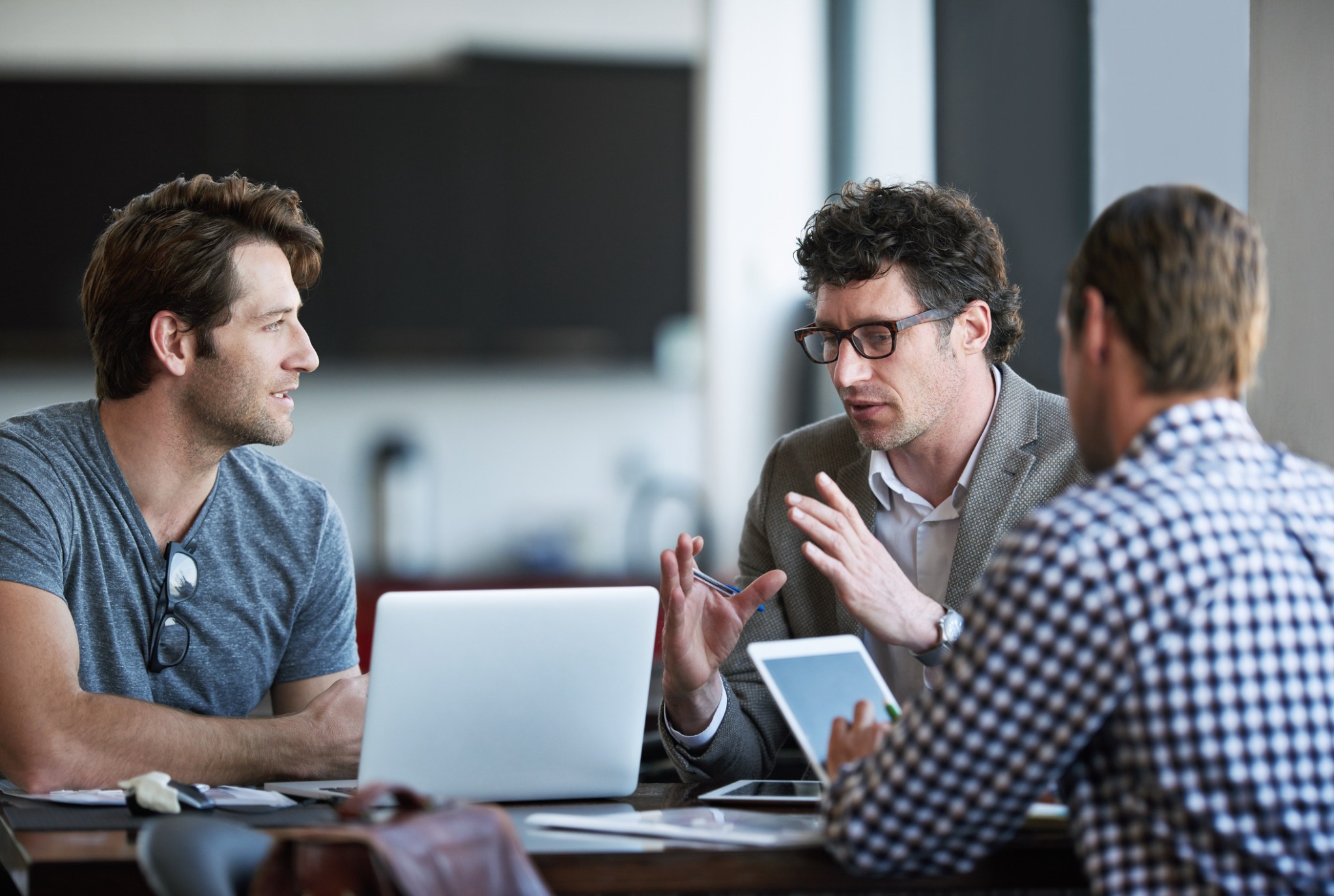 Three professionals working together